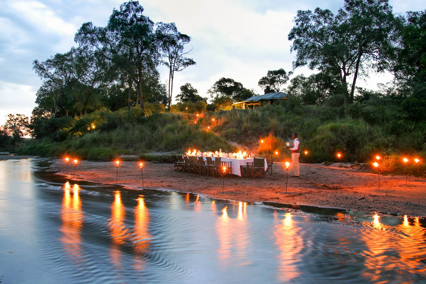 serengeti safari camps Great Wildebeest Migration salas camp sand river dinner candle lights
