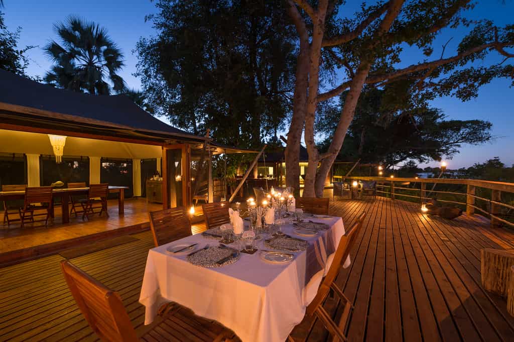 Outdoor dining area under a canopy of trees 