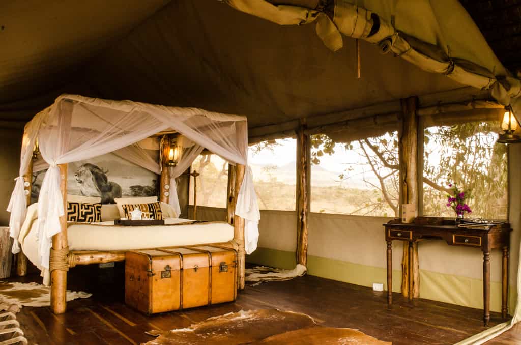 Relax in your own private tented cottage overlooking the vast wilderness from your veranda.