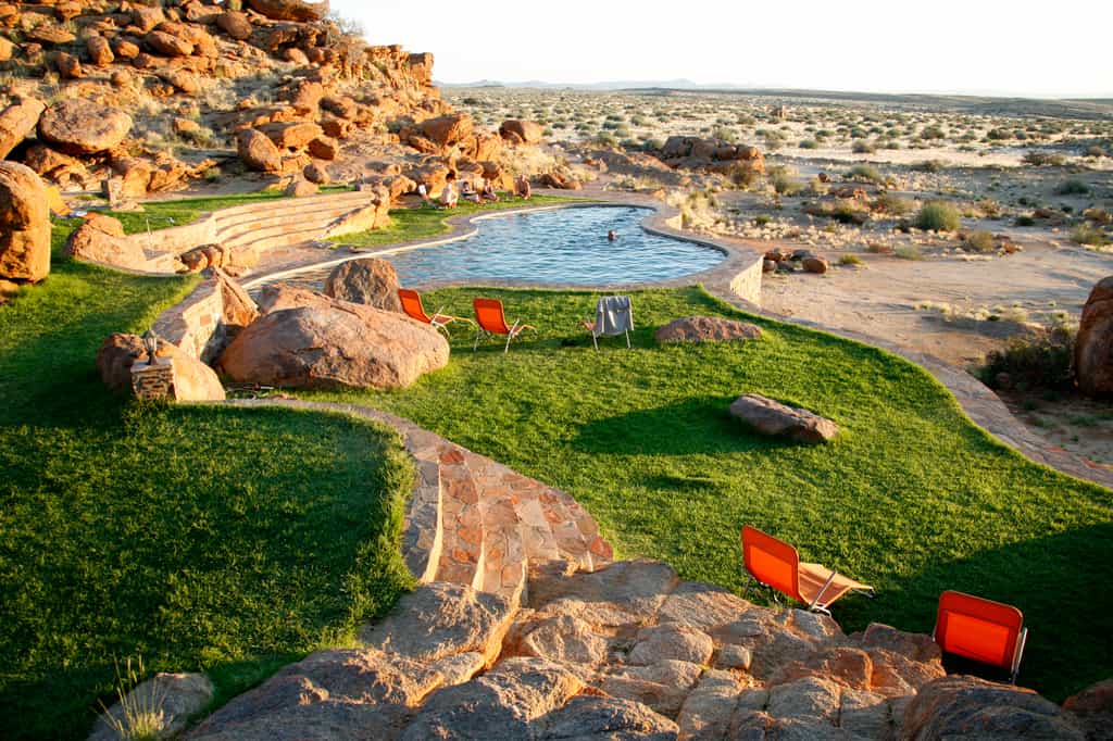 The swimming pool has a stunning view of the surrounding landscape.