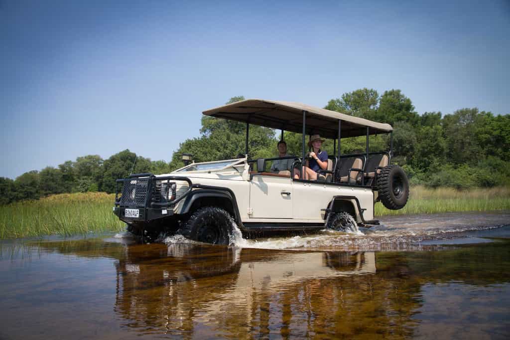 Land Rovers to transfer you into camp across Delta flood plains