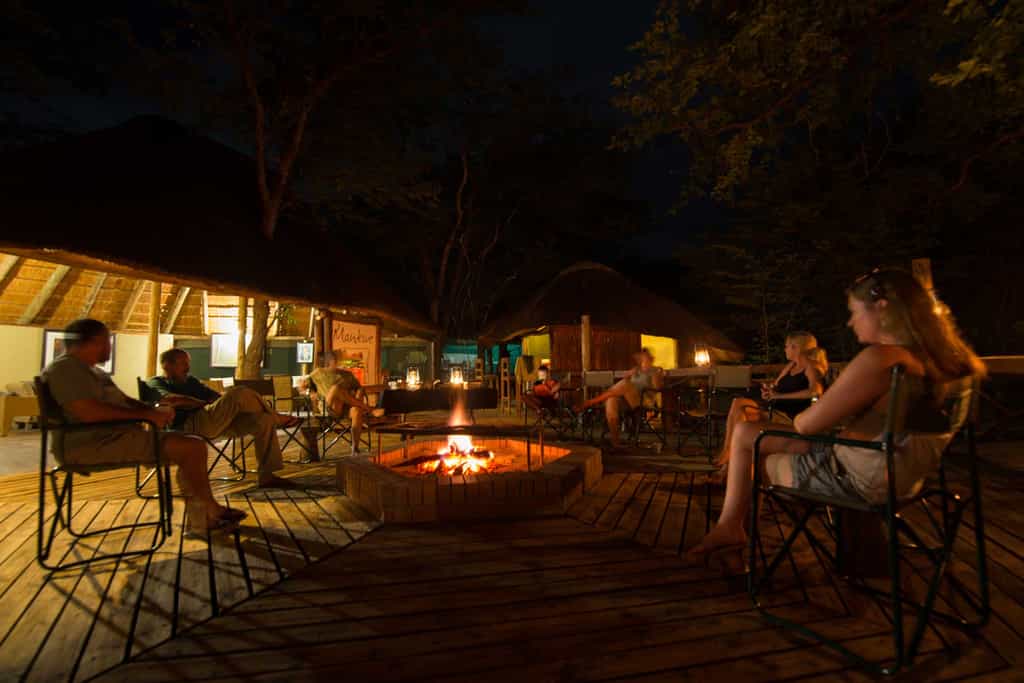 Guests enjoying the boma fire after dinner