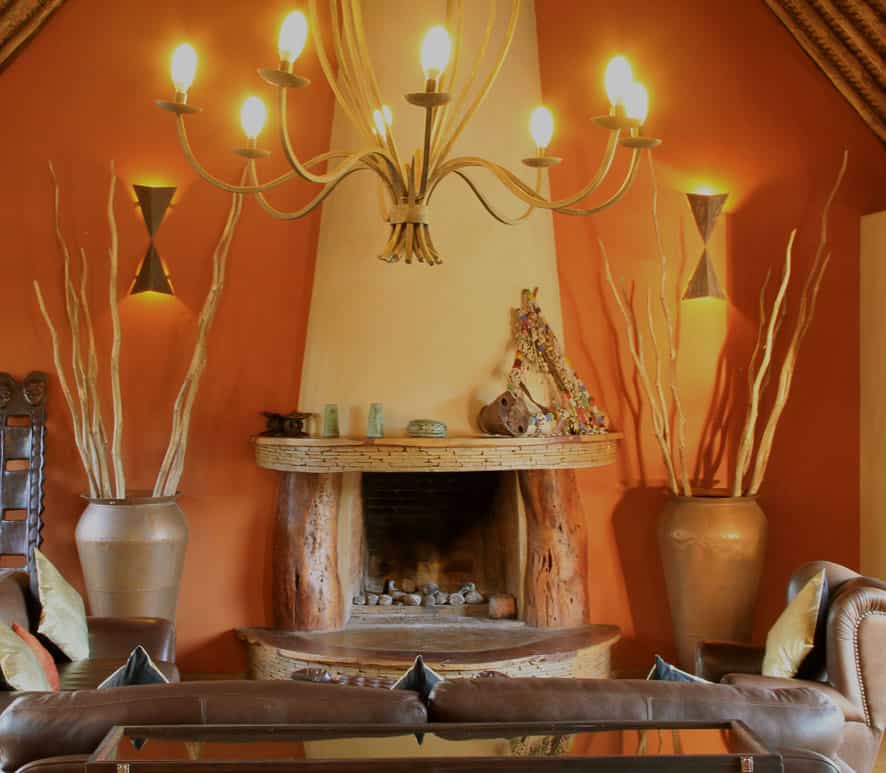 Lounge for drinks or board games by the fireplace