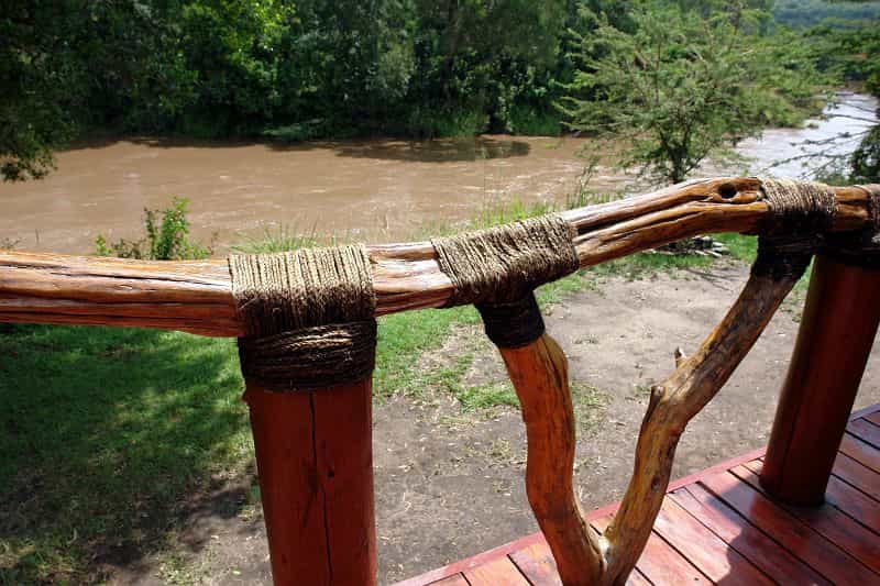 Outside on of the chalets facing the river