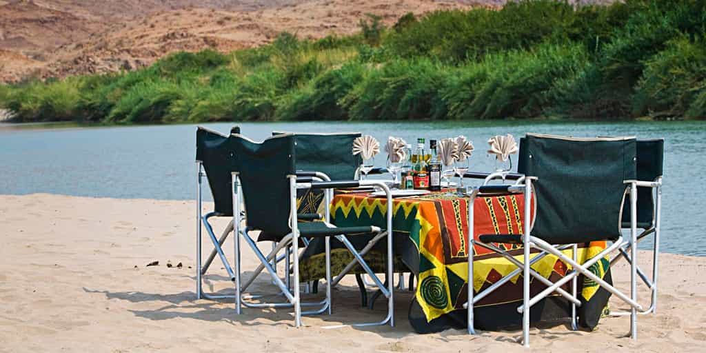 Outdoor dining next to the Kunene River