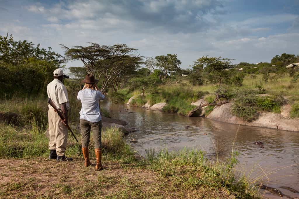 Enjoying a guided bush walk along the Grumeti River