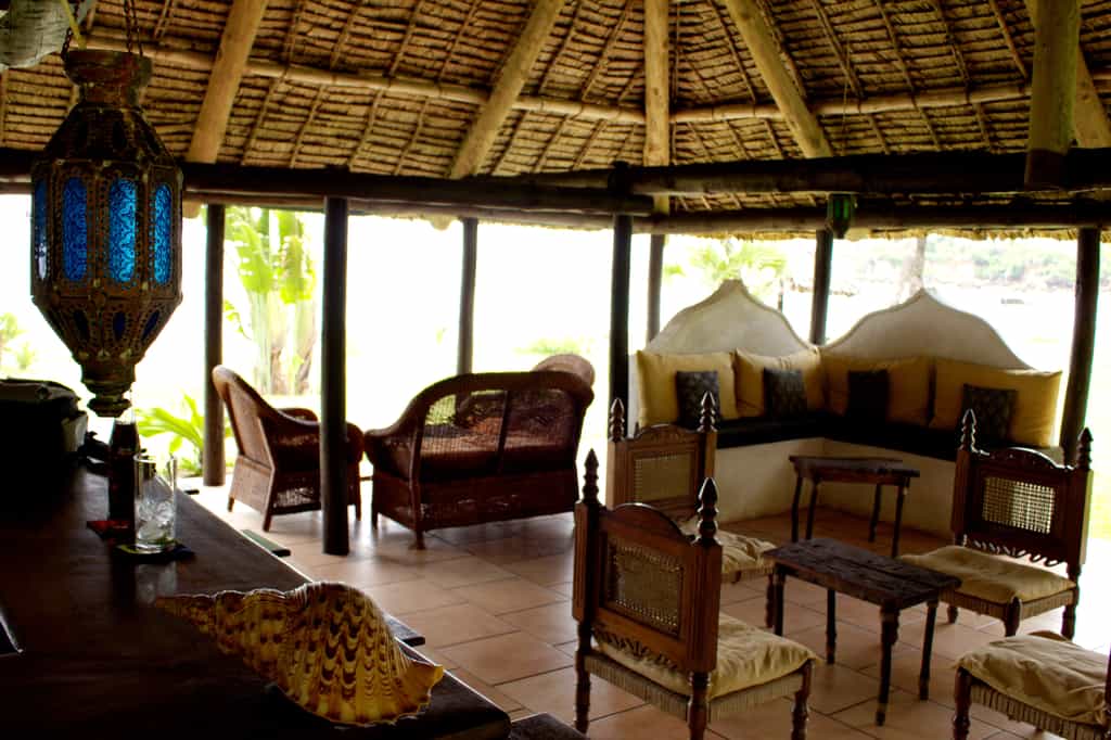 The open-sided makuti thatch beach bar provides the ideal outdoor seating area to enjoy the refreshing coastal breeze without the glare of the African sun
