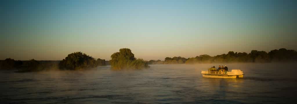Explore the Upper Zambezi and surrounding Islands on an early morning Sunrise Boat Cruise