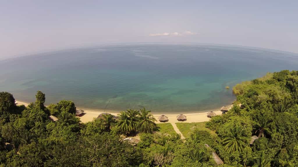 Bird's Eye View of Lake Tangayika and the Beach Banda's made from thatch at Kungwe Beach Lodge
