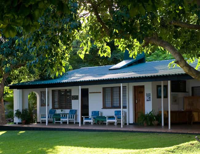 Spacious bedrooms open onto shady garden, leading down to the swimming pool and lake. 