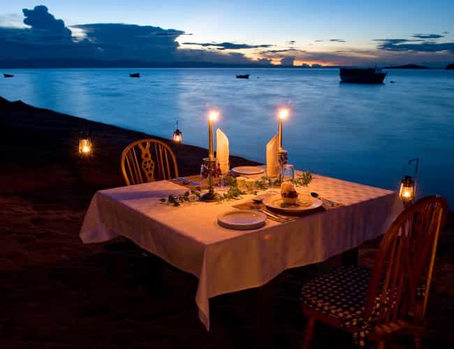Romantic setting on the beach watching sunset over Lake Malawi. 