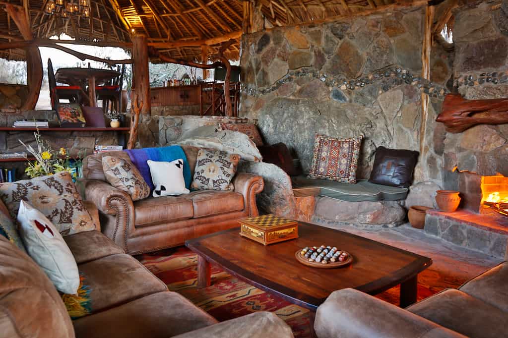 Main lounge area with log fire and cozy atmosphere