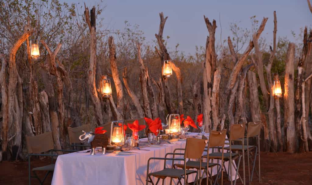Enjoying a meal under the African sky is often a magical highlight for our guests