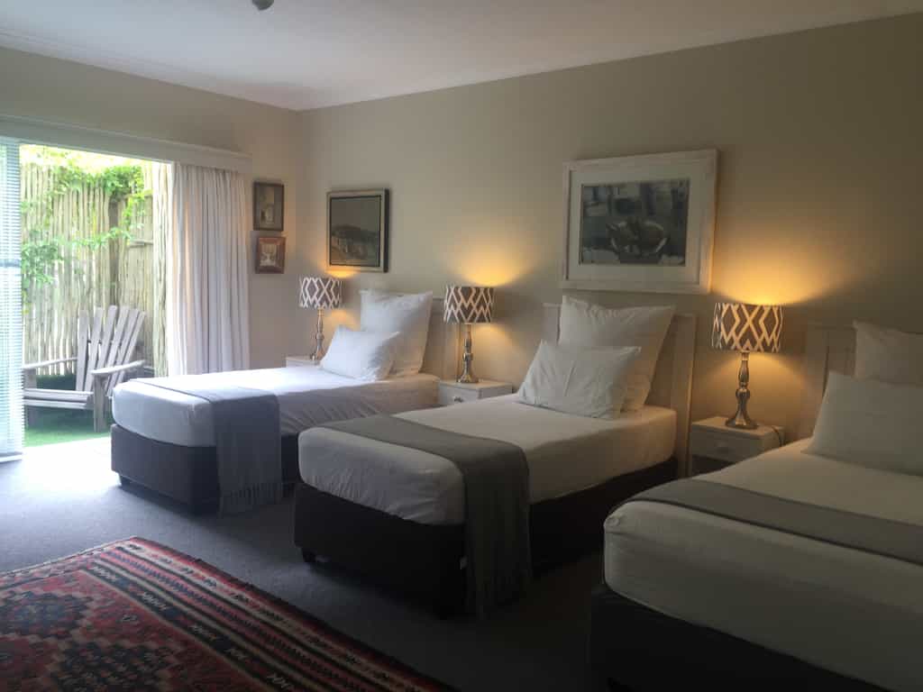 Second bedroom with king and 3/4 bed or 3 single beds. This bedroom has it's own entrance from outside and a full en-suite bathroom