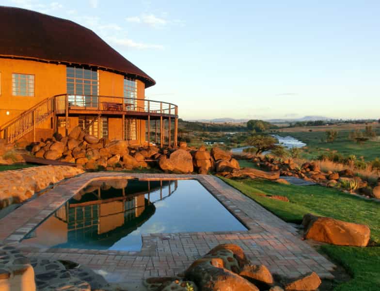 view from the pool shade of the main building and the Buffalo River, upstream