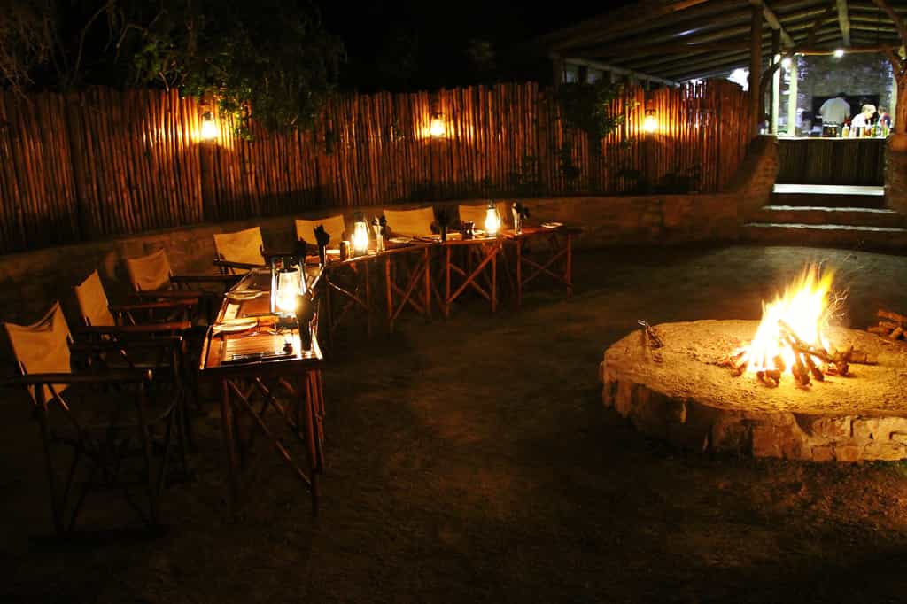 Guests are served fine fireside fare in the warm embrace of the evening fire.