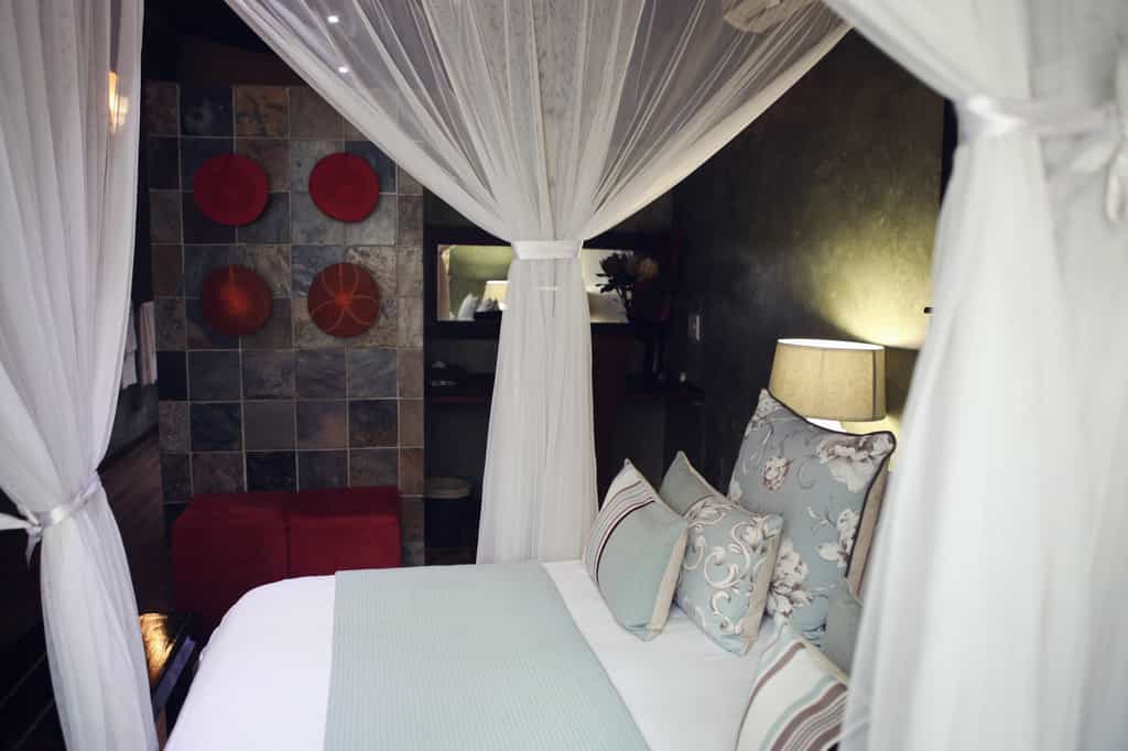 The Suite, Windfall Cottage, is privately situated under Marula trees and consists of a lounge with DSTV, romantic bedroom, en-suite bathroom and an outside shower in a privately fenced Boma area.