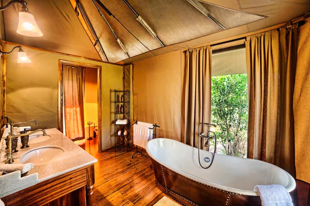 A decadent bath, or an adventurous outdoor shower await after a day of safari.