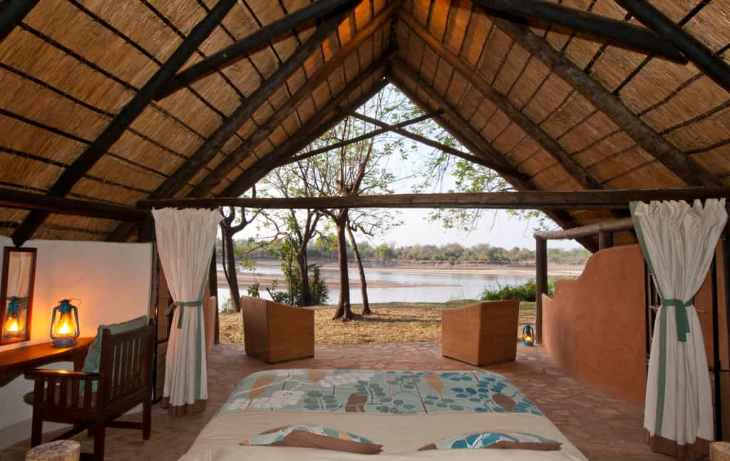 Private open fronted chalets looking onto the Luangwa and Park