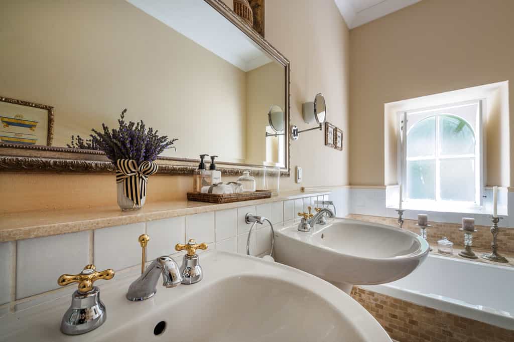 Most of our bathrooms have separate baths & showers, with his & hers basins