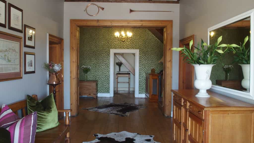 Yellowwood and shades of green & raspberry make a welcoming entrance to Belvidere House