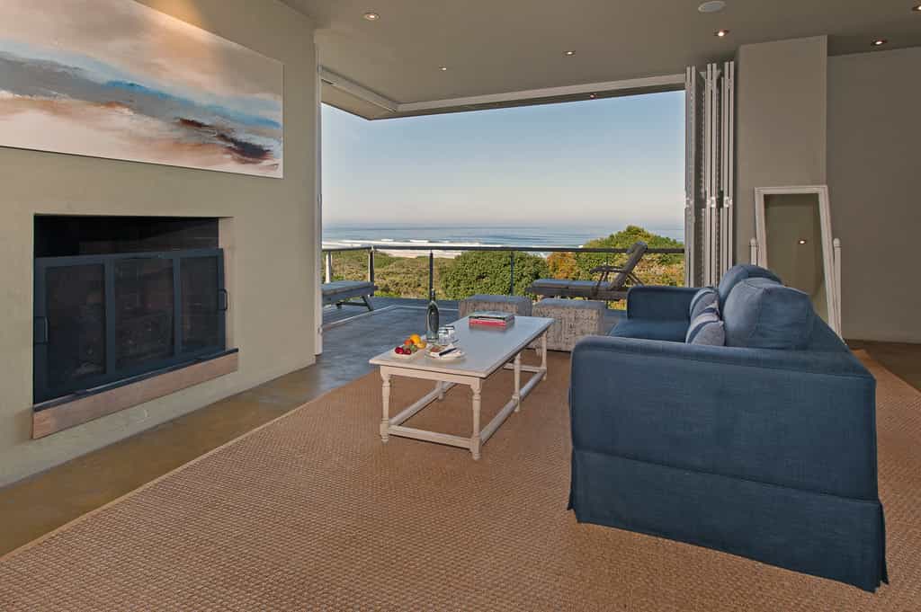 Seating area, Fireplace and sea facing balcony