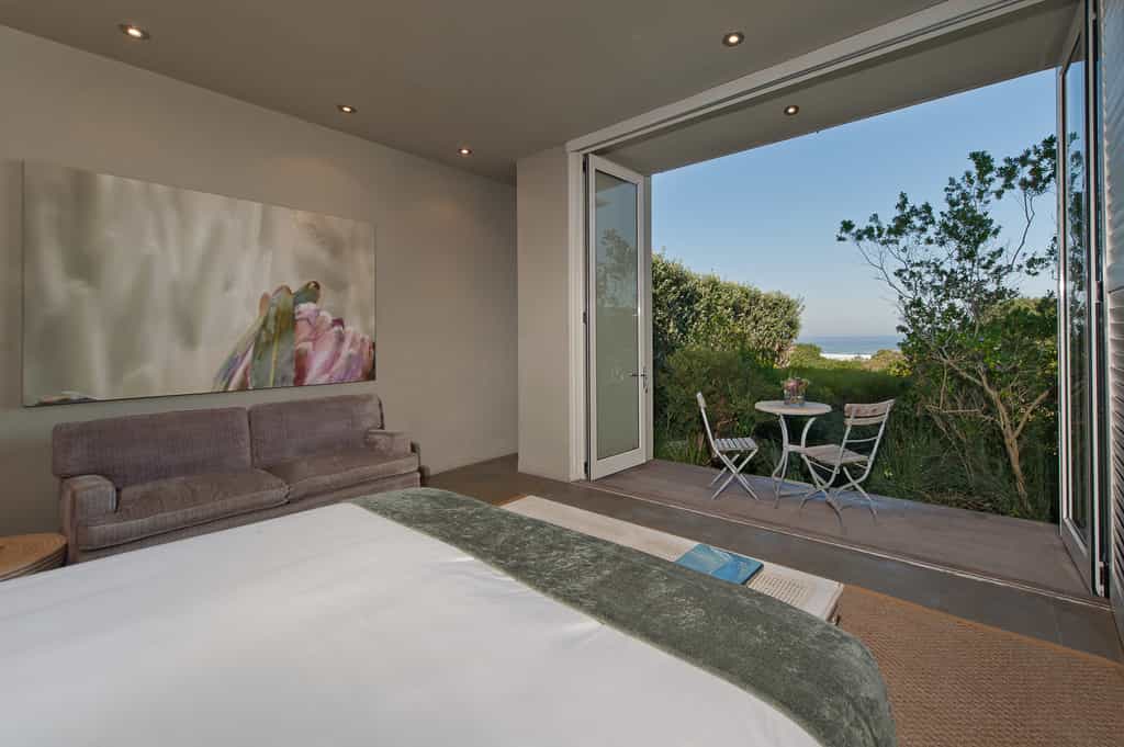 King bed, double sleeper couch and balcony of Fynbos executive suite