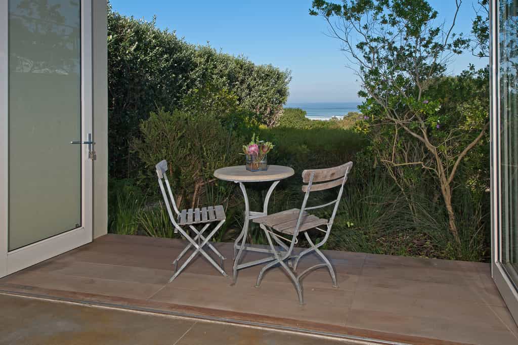 Sea facing balcony overlooking the natural Fynbos garden