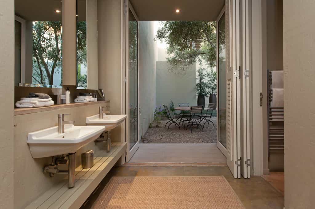 Double basins and bathroom oentrance to the right with a semi private quart yard leading from Fynbos executive suite