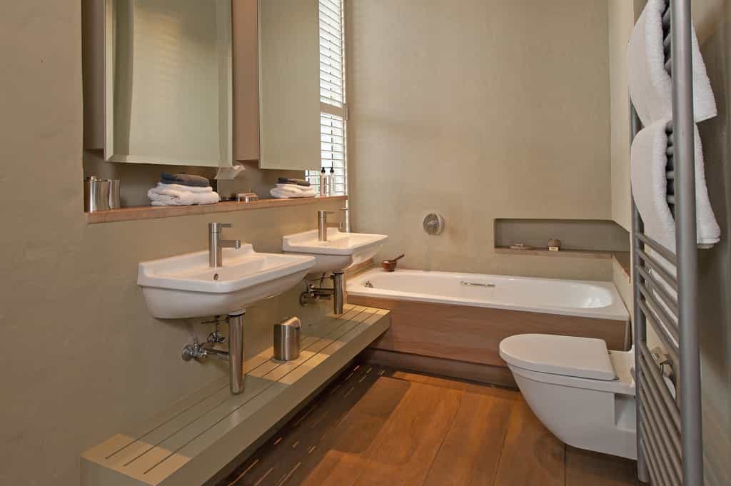 Bathroom with double basin, bath toilet and shower