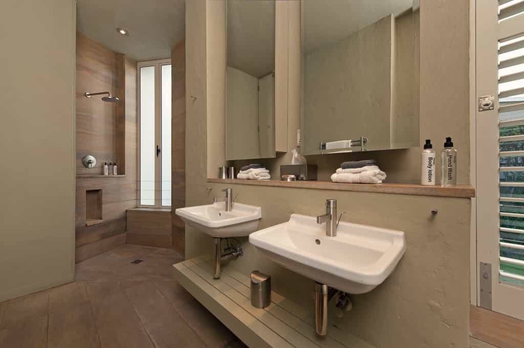 Double basins and shower with sandstone 