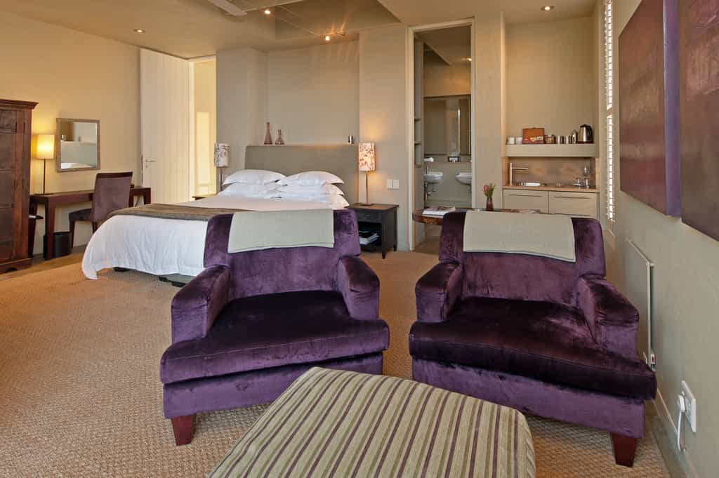 Seating area and kitchenette with King bed on left