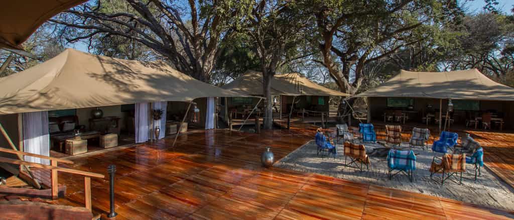 Meru-style tents form the common area and open onto a central deck and fire pit.