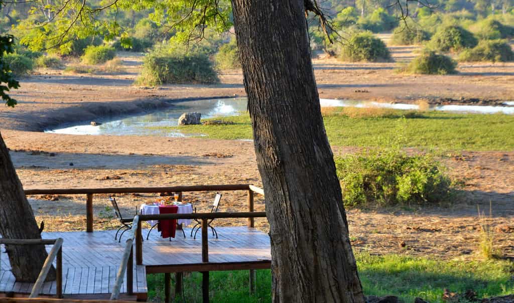 Private meal on deck overlooking waterhole