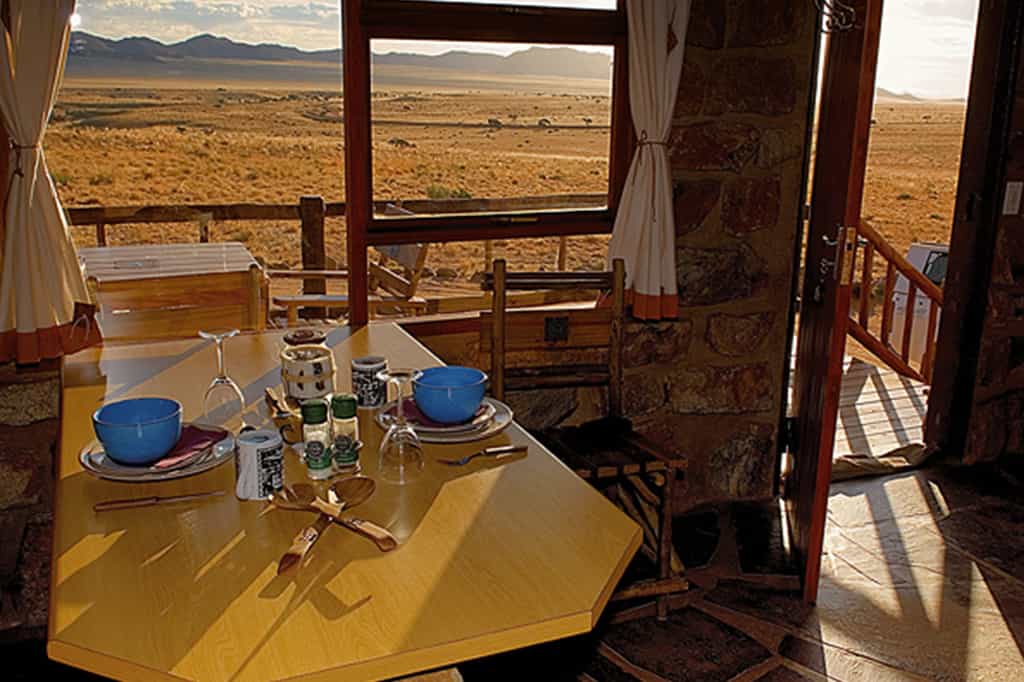 The chalets are nestled against a mountain slope and afford unique views of the boundlessness of the desert.
