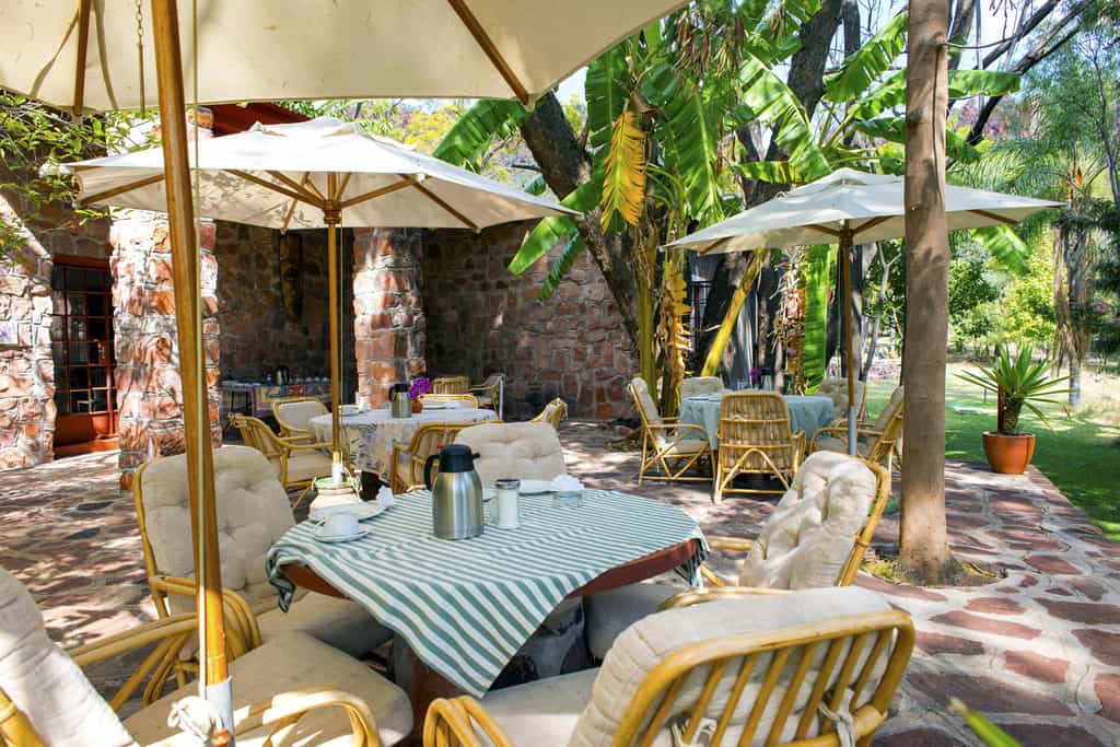 Enjoy coffee and cake in the tranquil garden of the Waterberg Wilderness Lodge.