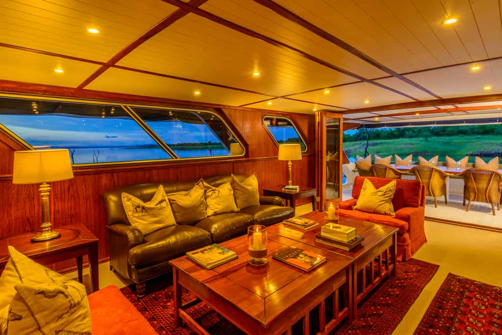 The middle deck offers a spacious and elegantly decorated dining area and lounge, opening up onto a covered verandah for al fresco meals.
