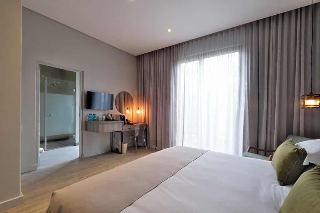 On levels two and three, accessed by either staircase or elevator, are two extraordinary Superior Mountain View Rooms. These rooms are substantial in size and overlook Signal Hill and on towards the Lions Head Mountain. The rooms are designed with an emphasis on combining urban chic with the tones of nature with an exciting, and slightly minimalistic, result.