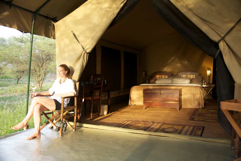 Enjoying a drink by one of 6 guest tents