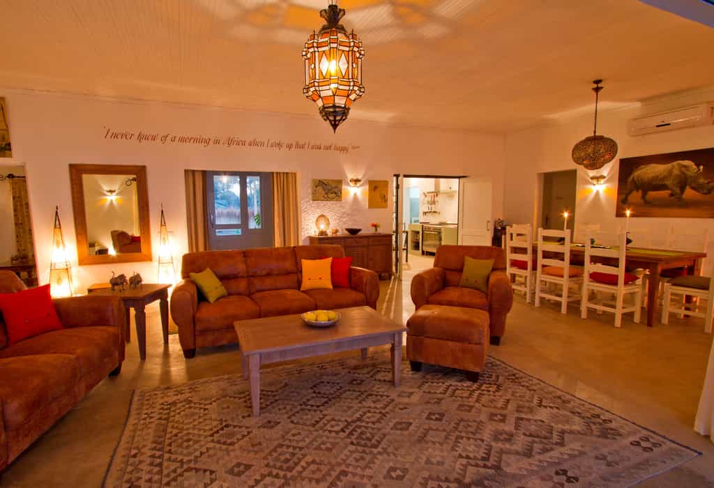 The huge indoor lounge with comfortable sofas and dining area with kitchen leading off.   Perfect for chilly evenings.