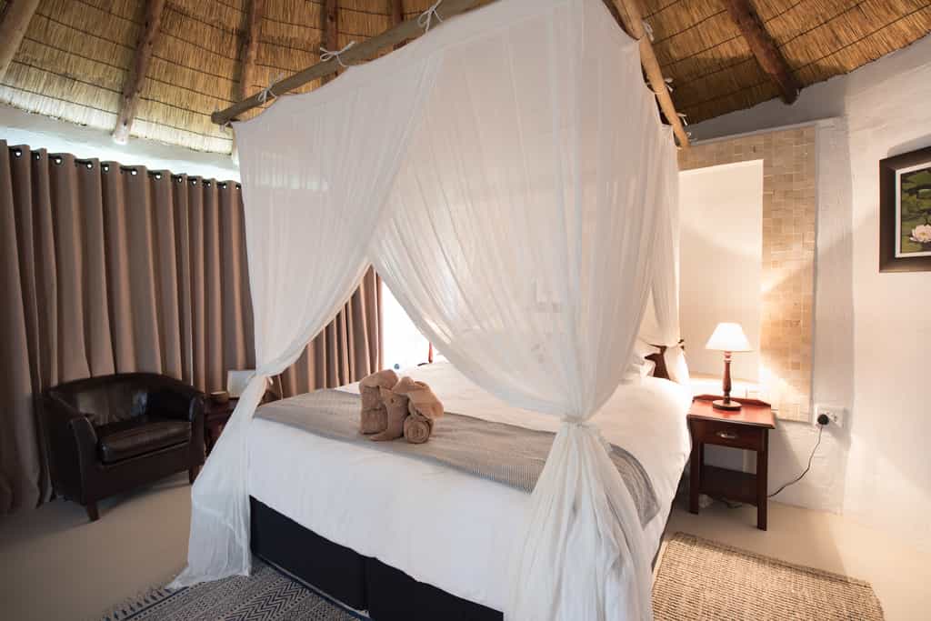 King size bed with luxury mozzie net and en-suite bathroom