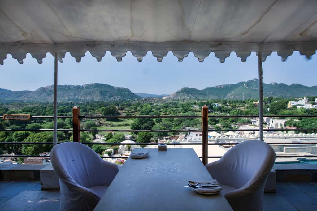 Restaurant seating extended outside with canopy and Mudda seating