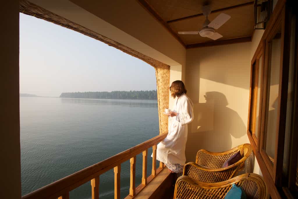 Guest relaxing in the private balcony of their room