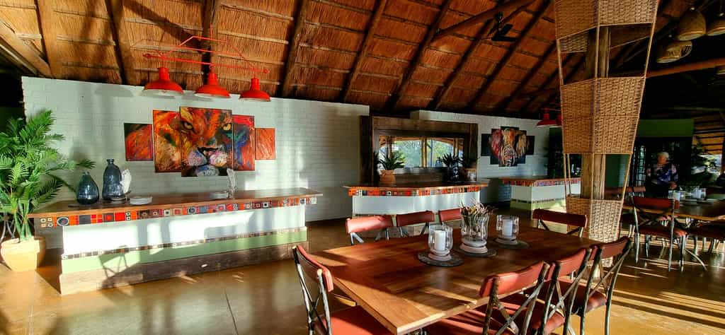 The furniture is earthy and sophisticated, brought to life with splashes of colour and a touch of bush bohemia in the art and fabric.