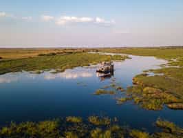 Gaze at wildlife from a boat safari in Linyanti