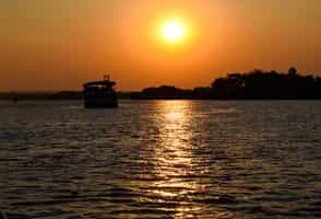 Float down the Zambezi on a sundowner cruise
