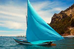 Take in the sunset on a sailboat on Lake Titicaca