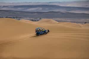 Soar across the Paracas dunes in a sand buggy