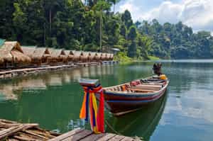 Take traditional longtail boats on Cheow Larn Lake