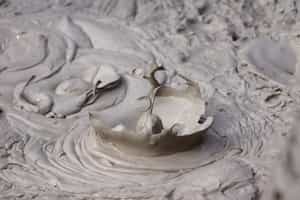 Take a mud bath and swim at the hot springs